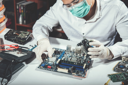The technician repairing the computer,computer hardware, repairi